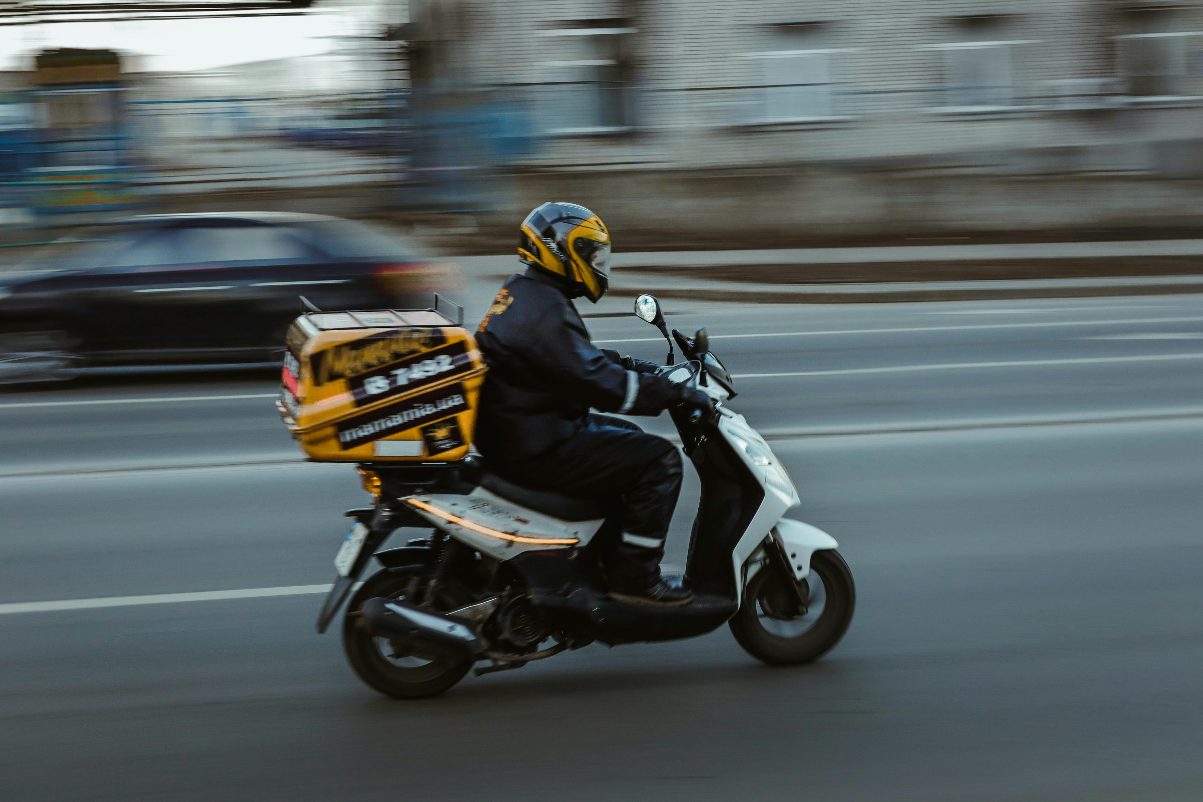 Express delivery service India - courier picking up an urgent parcel for same day dispatch
